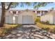 Attached garage with driveway, offering convenient parking at 1420 Water View W Dr # 203, Largo, FL 33771