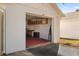 Garage with cabinets, workbench, and red floor at 1420 Water View W Dr # 203, Largo, FL 33771