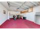 Garage with storage and two scooters at 1420 Water View W Dr # 203, Largo, FL 33771