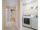 Hallway view of laundry room and bathroom at 1420 Water View W Dr # 203, Largo, FL 33771