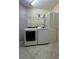 Bright laundry room, featuring a washer, dryer, and ample shelving at 1420 Water View W Dr # 203, Largo, FL 33771