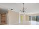 Spacious living room with hardwood floors, and access to balcony at 1420 Water View W Dr # 203, Largo, FL 33771