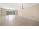 Bright living room featuring hardwood floors and sliding glass doors at 1420 Water View W Dr # 203, Largo, FL 33771