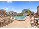 Community pool with lounge chairs and patio tables at 1420 Water View W Dr # 203, Largo, FL 33771