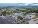 Aerial view of community center, tennis courts, and a Veteran's memorial at 1533 Emerald Dunes Dr, Sun City Center, FL 33573