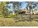 Large backyard with lush lawn and mature oak trees at 1533 Emerald Dunes Dr, Sun City Center, FL 33573