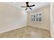 Bright bedroom with ceiling fan and tile floor at 1533 Emerald Dunes Dr, Sun City Center, FL 33573