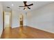 Spacious bedroom with hardwood floors and access to bathroom at 1533 Emerald Dunes Dr, Sun City Center, FL 33573