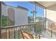 Enjoy this screened balcony with comfortable seating and a pool view at 809 Russell Ln # 323, Brandon, FL 33510