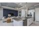 Modern kitchen with granite countertops and stainless steel appliances at 11216 Shoreline Trl, Parrish, FL 34219
