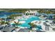 Expansive lagoon-style pool with multiple lounging areas at 11216 Shoreline Trl, Parrish, FL 34219
