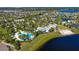 Community overview showing homes and lake at 11521 Lake Lucaya Dr, Riverview, FL 33579