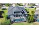 Home with a screened pool and patio, surrounded by lush landscaping at 11521 Lake Lucaya Dr, Riverview, FL 33579