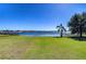 Picturesque backyard with lush lawn and lake view at 11521 Lake Lucaya Dr, Riverview, FL 33579