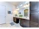 Elegant bathroom with double vanity, large mirror, and spacious layout at 11521 Lake Lucaya Dr, Riverview, FL 33579