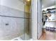 Modern bathroom with walk-in shower and adjacent closet at 11521 Lake Lucaya Dr, Riverview, FL 33579