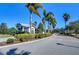 Community entrance with lush landscaping and guardhouse at 11521 Lake Lucaya Dr, Riverview, FL 33579