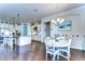 Bright dining area with white table and chairs, adjacent to kitchen at 11521 Lake Lucaya Dr, Riverview, FL 33579
