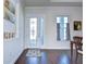 Bright and airy entryway with hardwood floors and a decorative door at 11521 Lake Lucaya Dr, Riverview, FL 33579