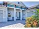 Inviting front entry with a covered porch and landscaping at 11521 Lake Lucaya Dr, Riverview, FL 33579