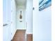 Hallway with hardwood floors and guitar niche display at 11521 Lake Lucaya Dr, Riverview, FL 33579