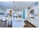 Large kitchen featuring a granite island, stainless steel appliances, and white cabinetry at 11521 Lake Lucaya Dr, Riverview, FL 33579
