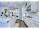Bright kitchen boasts granite countertops, stainless steel appliances, and white cabinets at 11521 Lake Lucaya Dr, Riverview, FL 33579