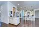 Modern kitchen with white cabinets, granite countertops, and an island at 11521 Lake Lucaya Dr, Riverview, FL 33579