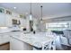 Gourmet kitchen with granite island, stainless steel appliances, and view to backyard at 11521 Lake Lucaya Dr, Riverview, FL 33579
