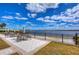 Seating area with lake view and umbrellas at 11521 Lake Lucaya Dr, Riverview, FL 33579