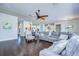Spacious living room featuring sectional sofa and hardwood floors at 11521 Lake Lucaya Dr, Riverview, FL 33579