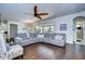Relaxing living room with sectional sofa and hardwood floors at 11521 Lake Lucaya Dr, Riverview, FL 33579