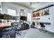 Home office with multiple monitors, guitar wall, and keyboard at 11521 Lake Lucaya Dr, Riverview, FL 33579