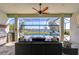 Relaxing outdoor space with a covered patio, pool, and lake view at 11521 Lake Lucaya Dr, Riverview, FL 33579