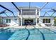 Resort-style pool with expansive covered patio and two-story home at 11521 Lake Lucaya Dr, Riverview, FL 33579