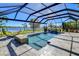 Spacious pool and lanai with lake view, screened enclosure, and paver deck at 11521 Lake Lucaya Dr, Riverview, FL 33579