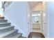Staircase with carpet runner and view of upstairs bathroom at 11521 Lake Lucaya Dr, Riverview, FL 33579