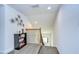 Upstairs hallway with bookcase and decorative wall art at 11521 Lake Lucaya Dr, Riverview, FL 33579
