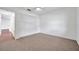 Neutral bedroom featuring a ceiling fan and closet with multiple doors at 1606 Berwick Ct # 10B, Palm Harbor, FL 34684