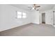 Bedroom featuring a ceiling fan and closet at 1606 Berwick Ct # 10B, Palm Harbor, FL 34684