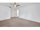 Neutral bedroom featuring a ceiling fan and closet at 1606 Berwick Ct # 10B, Palm Harbor, FL 34684