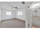 Bedroom featuring a ceiling fan and ensuite bathroom at 1606 Berwick Ct # 10B, Palm Harbor, FL 34684