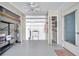 A spacious garage with utility sink, water heater, open shelves and additional closet space, freshly painted at 1606 Berwick Ct # 10B, Palm Harbor, FL 34684