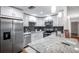 Modern kitchen features granite countertops, stainless appliances, and subway tile backsplash at 1606 Berwick Ct # 10B, Palm Harbor, FL 34684