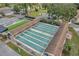 Aerial view of the community shuffleboard courts providing residents a fun recreation area at 1606 Berwick Ct # 10B, Palm Harbor, FL 34684