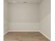 Empty room with light grey walls and wood-look flooring at 12355 Hearts Ease St, Venice, FL 34293