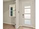 Bright entryway with modern door and wood-look floors at 12355 Hearts Ease St, Venice, FL 34293