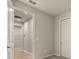 Bright hallway with doors to bedrooms and closets at 12355 Hearts Ease St, Venice, FL 34293