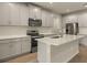 Modern kitchen featuring stainless steel appliances and an island at 12355 Hearts Ease St, Venice, FL 34293