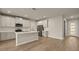 Open concept kitchen with island and stainless steel appliances at 12355 Hearts Ease St, Venice, FL 34293